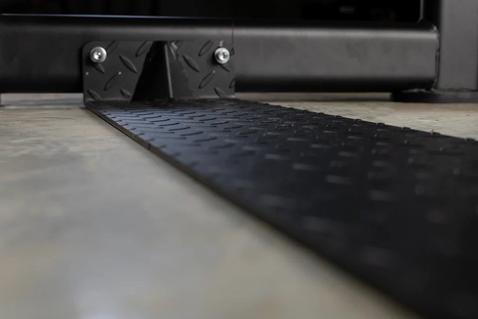 Close-up of diamond-plated lower support plate for enhanced stability