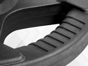 Close-up of tri‑grip handles on XMark Olympic plate