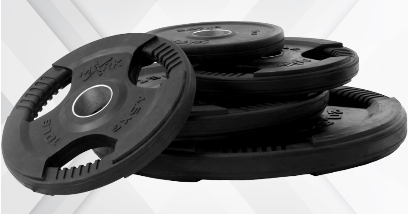 Multiple XMark Tri‑Grip plates in different weight sizes