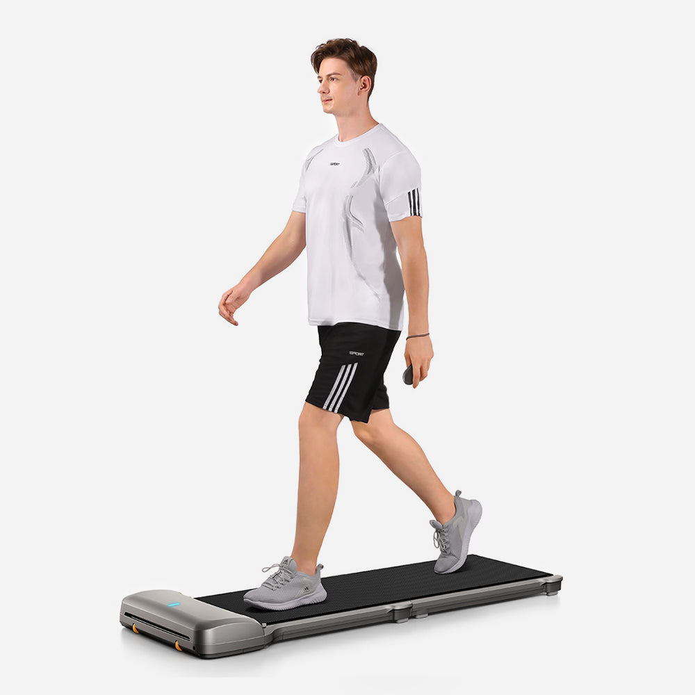 Person walking on the WalkingPad C1 Compact Foldable Treadmill for home