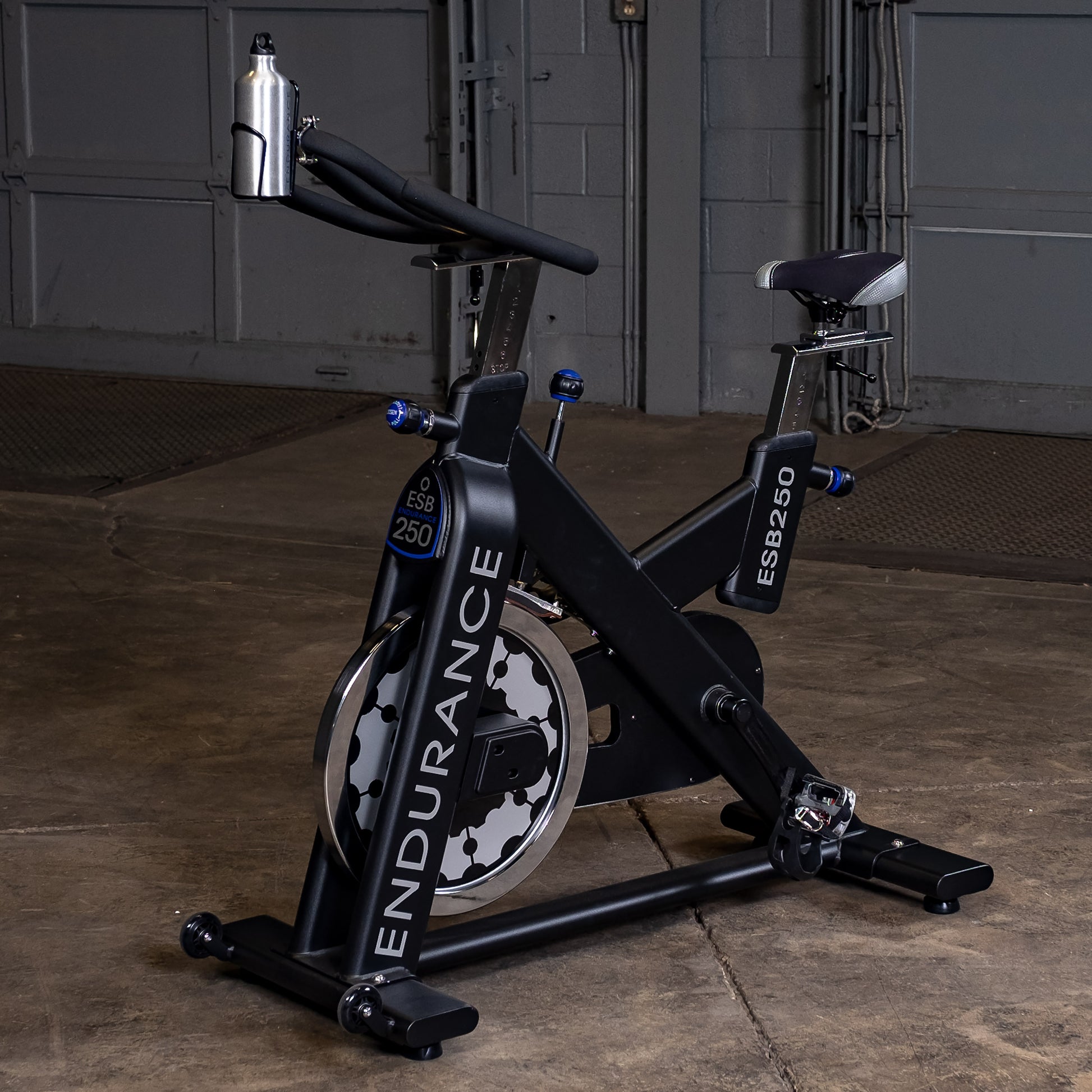 Side view of the Endurance by Body-Solid ESB250 Spin Bike showing flywheel and frame