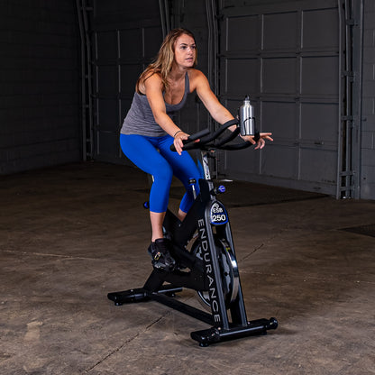 Woman spinning on the Endurance by Body-Solid ESB250 Spin Bike