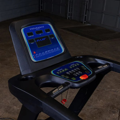 Close-up of the Endurance T25 LED console with speed, time, and workout program controls.