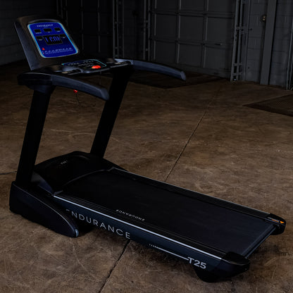 Side view of the Body-Solid Endurance T25 Folding Treadmill showing compact design and running deck.
