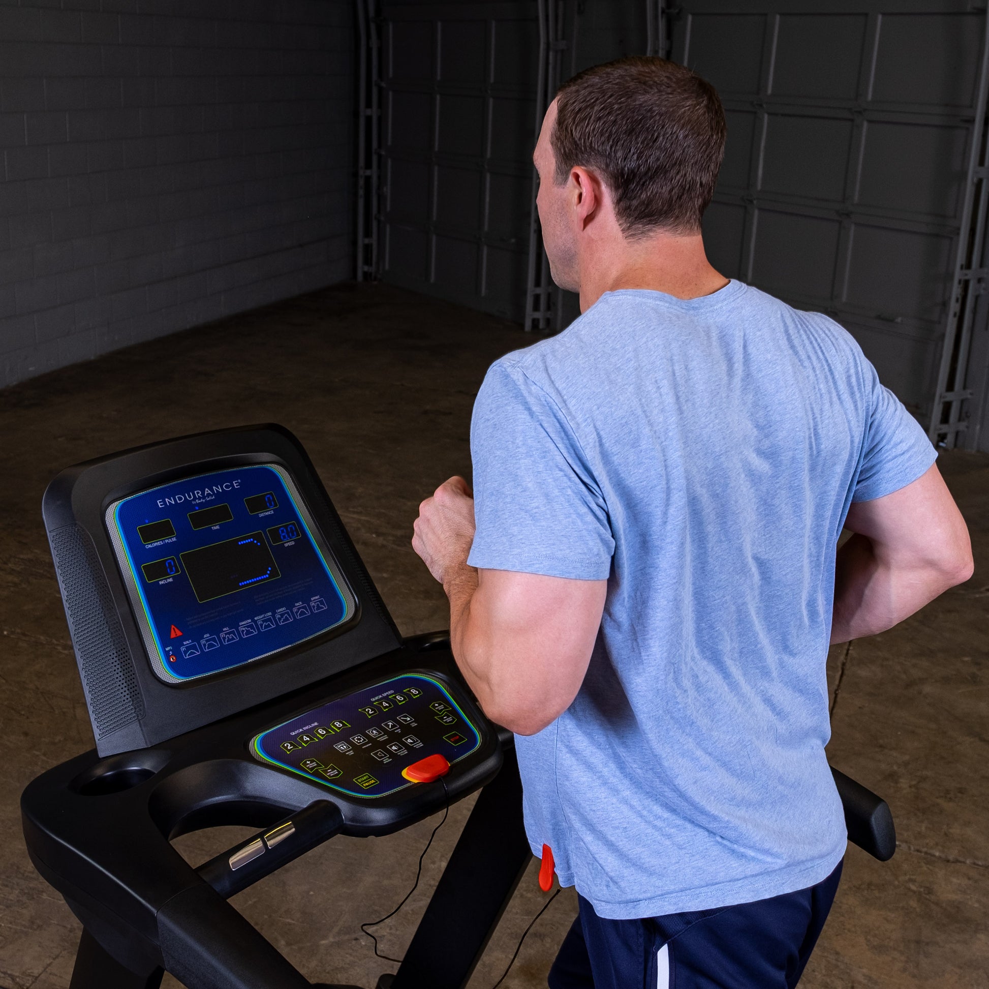 Person jogging on the Body-Solid Endurance T25 Folding Treadmill during a home workout.