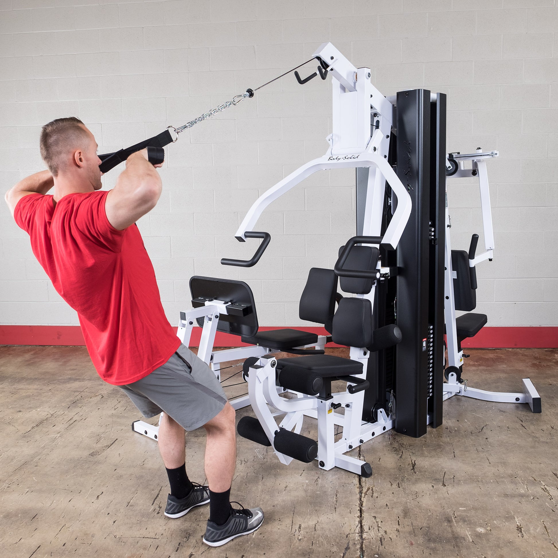 Body-Solid EXM3000LPS pec dec and press arm station for chest and shoulder exercises.