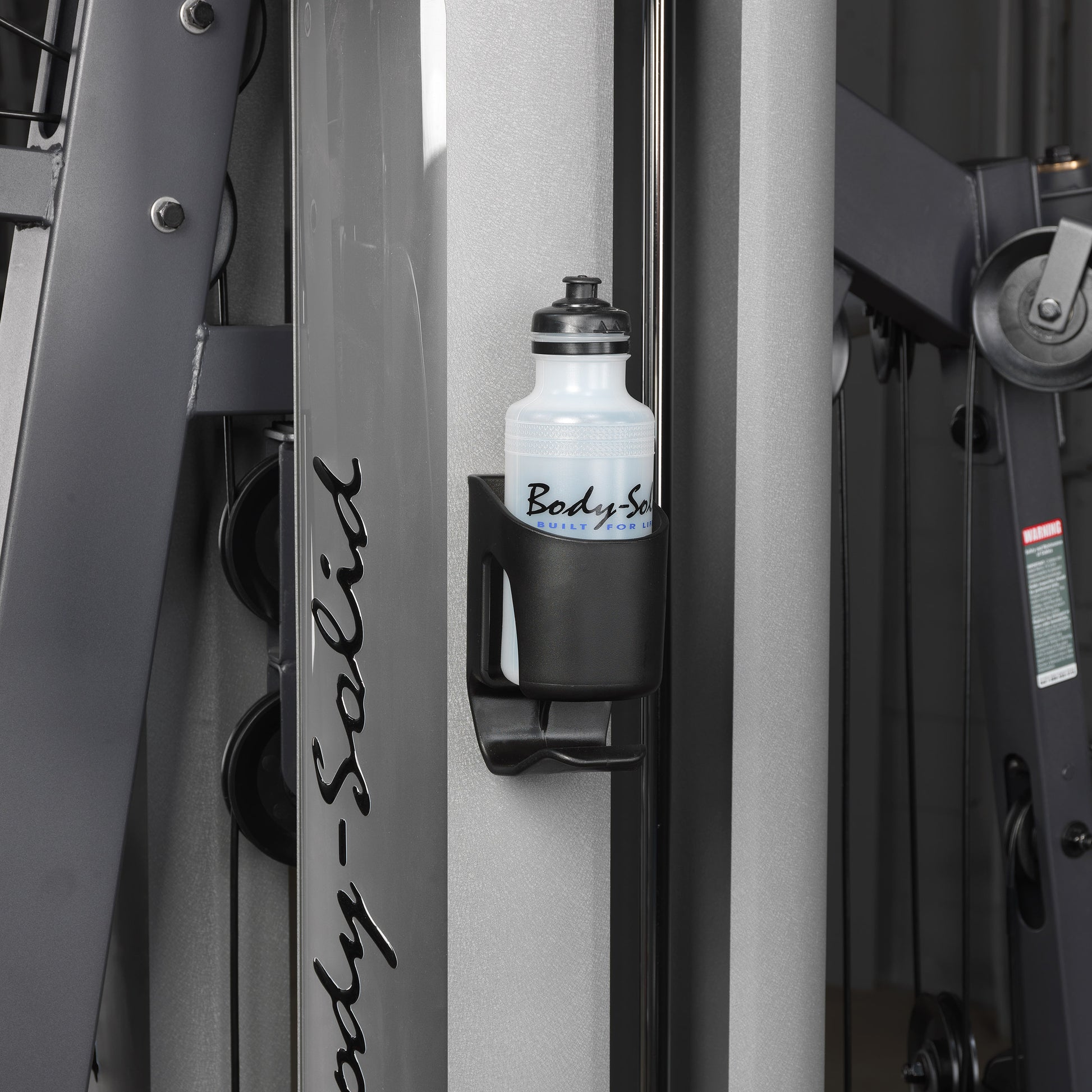 Close-up of the water bottle holder on the Body-Solid G9S Two Stack Gym