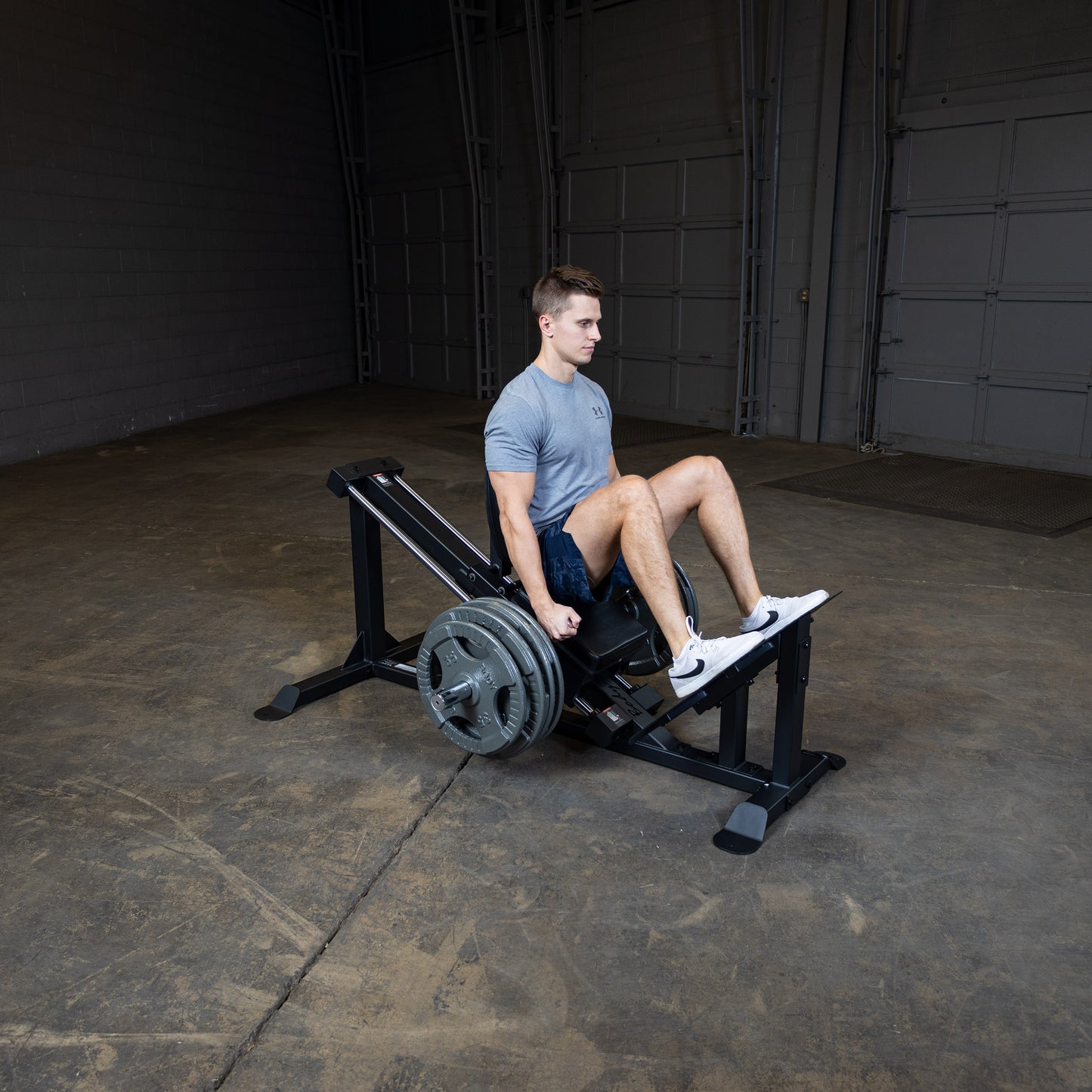 User performing leg press on Body-Solid GCLP100