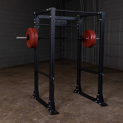 Full view of the Body‑Solid GPR400 power rack in a home gym with weights