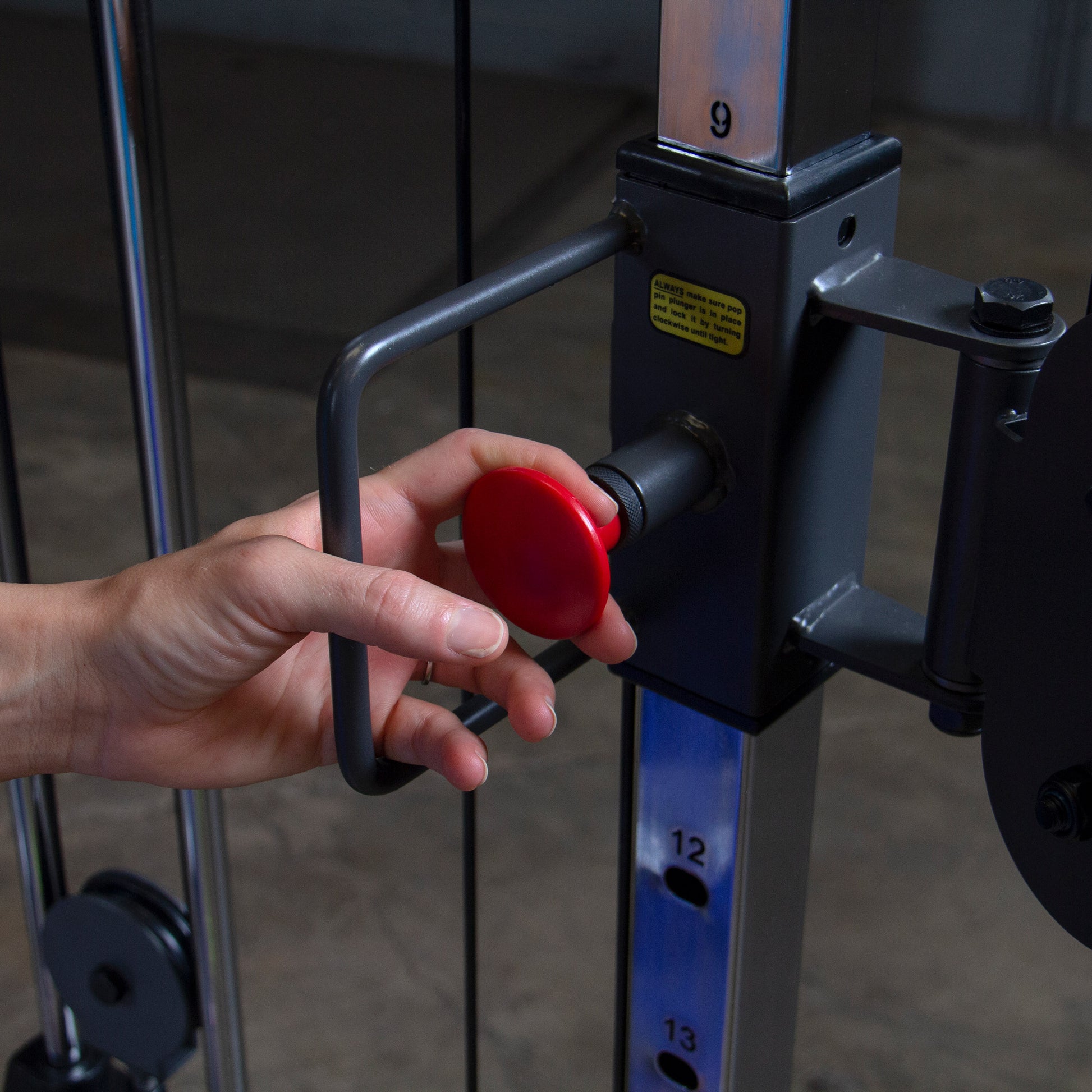 Adjustable pulley system on Body-Solid Powerline PFT100 Functional Trainer for versatile strength training exercises.
