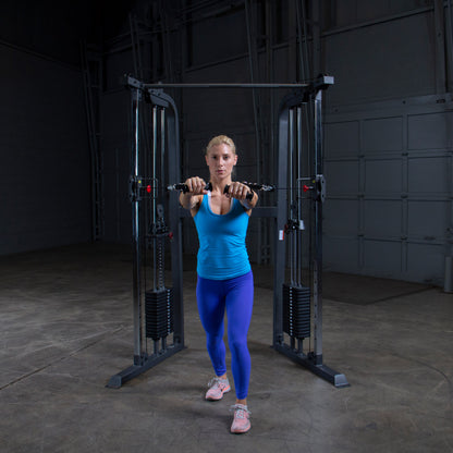 Athlete performing a chest workout on Body-Solid Powerline PFT100 Functional Trainer with smooth cable operation.