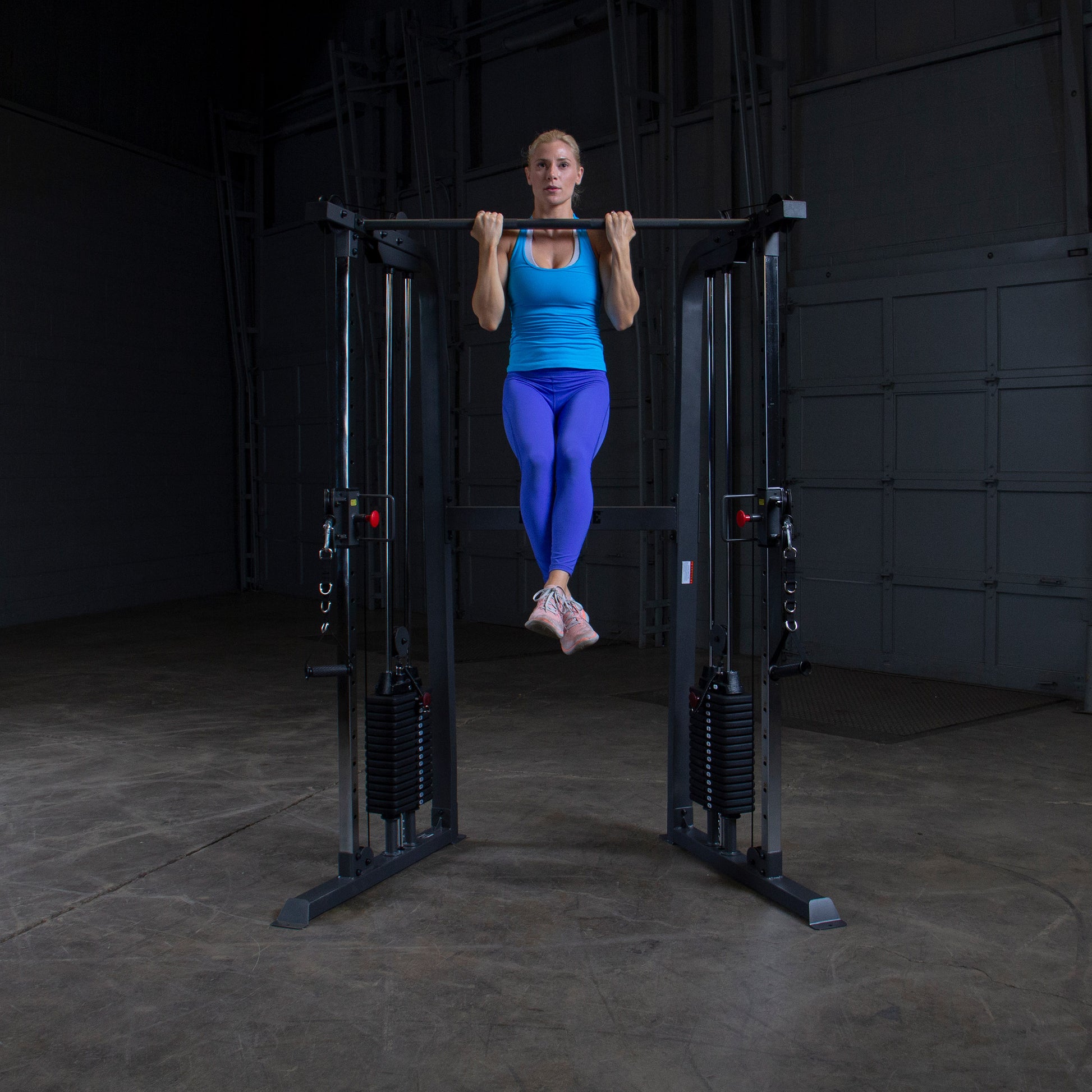 Athlete performing a full-body workout on Body-Solid Powerline PFT100 Functional Trainer with smooth cable operation.