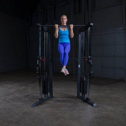 Athlete performing a full-body workout on Body-Solid Powerline PFT100 Functional Trainer with smooth cable operation.