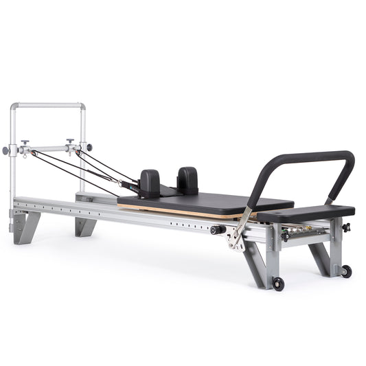 Full view of the Elina Pilates Aluminum Reformer Mentor in black upholstery with accessories attached