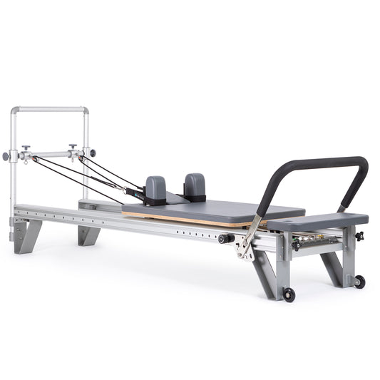 Full view of the Elina Pilates Aluminum Reformer Mentor in grey upholstery with accessories attached