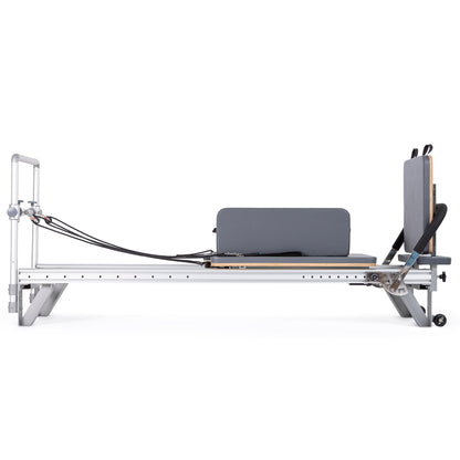 Extra-wide padded box accessory on the Elina Pilates Mentor Reformer designed for core and flexibility training