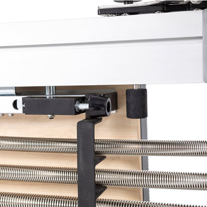 Close-up of spring attachment points on the Elina Pilates Aluminum Reformer Mentor for resistance customization