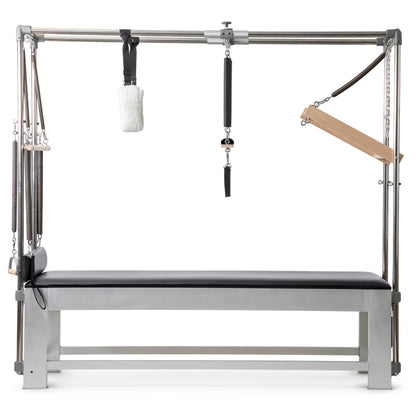Full set of included accessories—springs, trapeze bar, push bar, arm bar, fuzzy handles, and Kuna board.