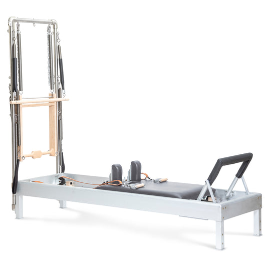 Elina Pilates Classic Aluminum Reformer 86″ with integrated tower, polished aluminum and grey upholstery, front view.