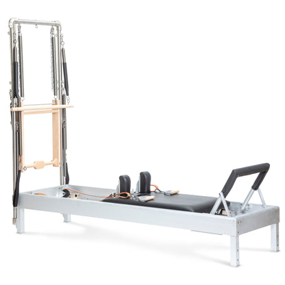 Elina Pilates Classic Aluminum Reformer 86″ with integrated tower, polished aluminum and black upholstery, front view.