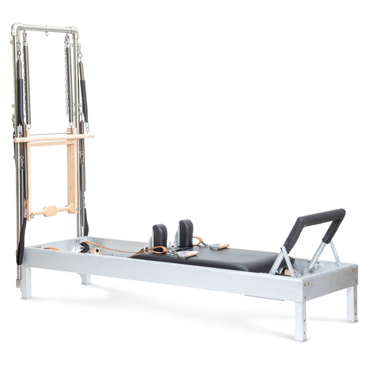 Elina Pilates Classic Aluminum Reformer 86″ with integrated tower, polished aluminum and black upholstery, front view.