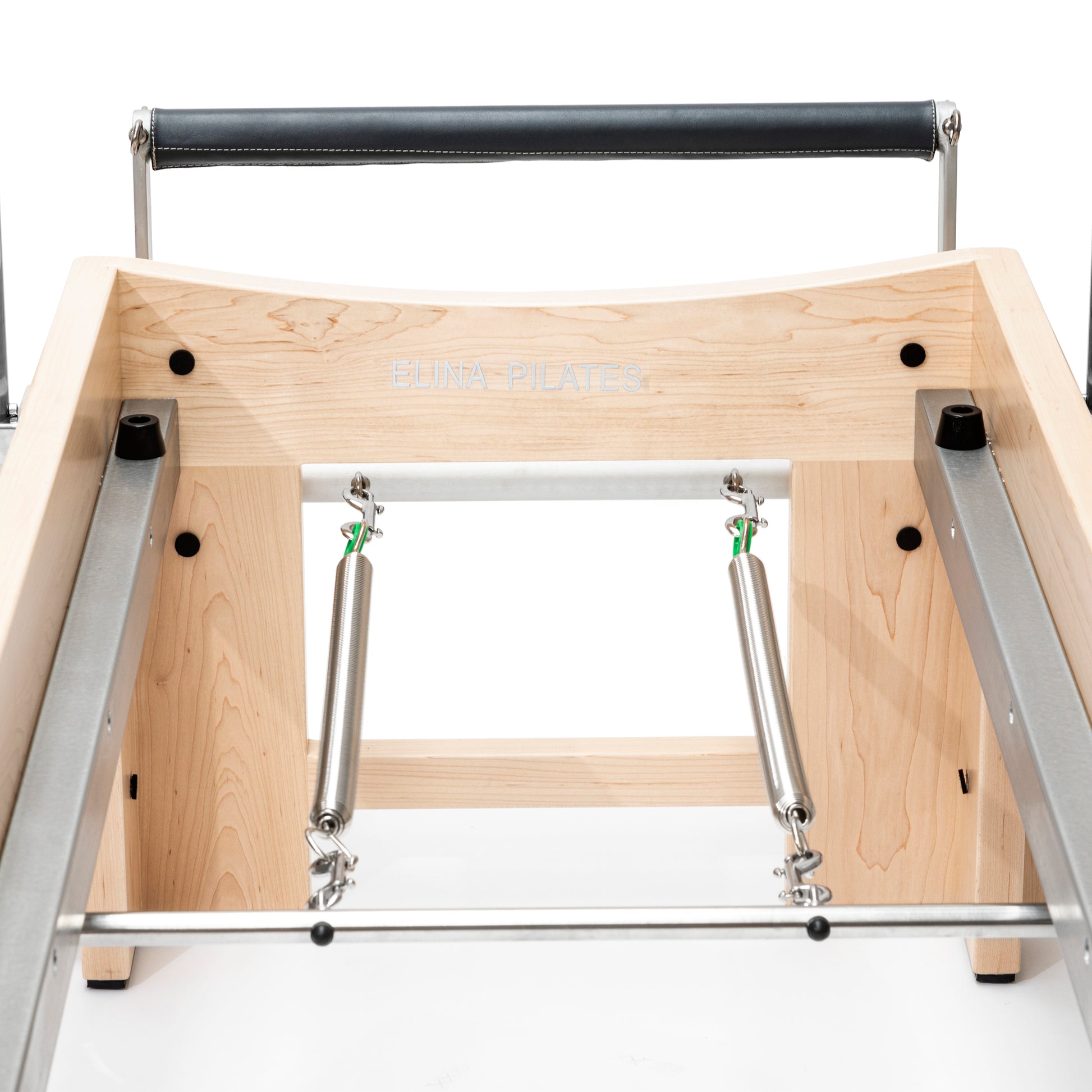 Close-up of the smooth eight-wheel carriage system and two-piece rail on the Elite Cadillac Reformer