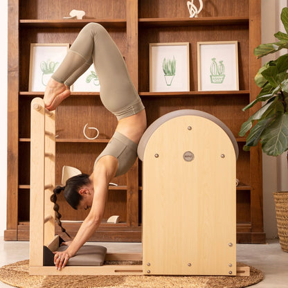 Woman using the Elina Pilates Elite Ladder Barrel for workout