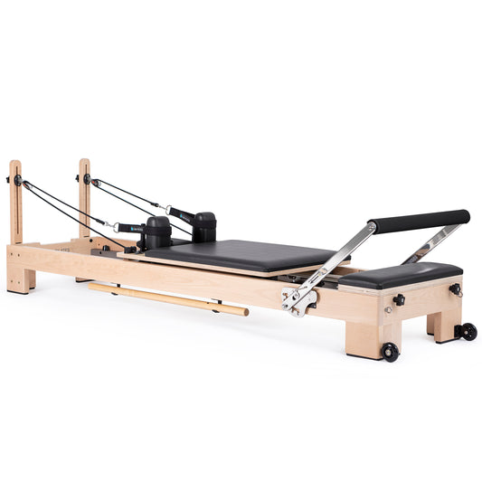 Full view of the Elina Pilates Wooden Reformer Lignum™ Bundle with beechwood frame and accessories