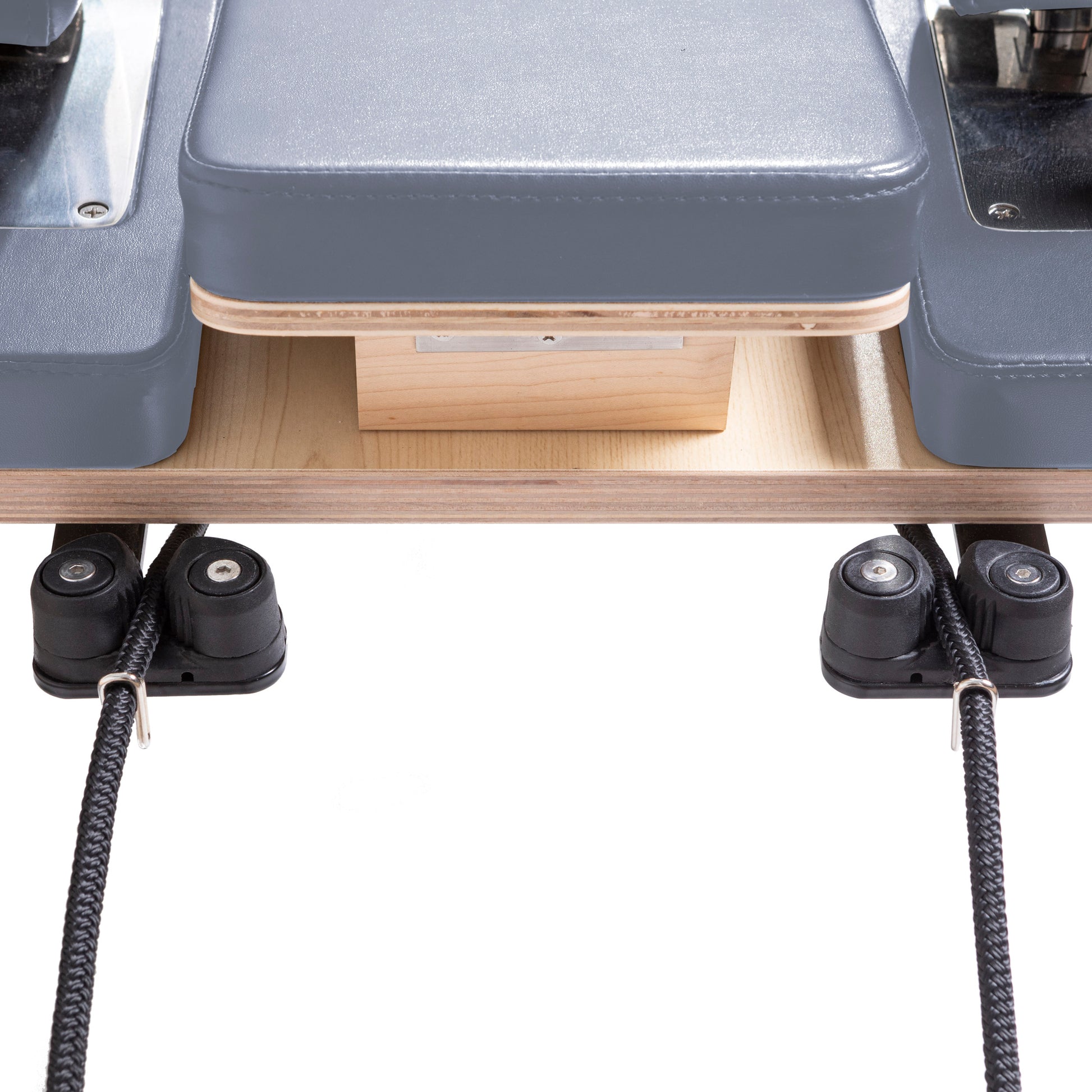 Ultra-quiet carriage with eight wheels and retractable rope system on Master Instructor™ Reformer