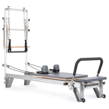 Full view of the Elina Pilates Mentor Reformer with Full Tower in grey upholstery