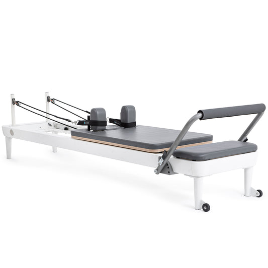 Full view of the Elina Pilates Nubium Reformer showcasing the sleek aluminum frame and grey upholstery