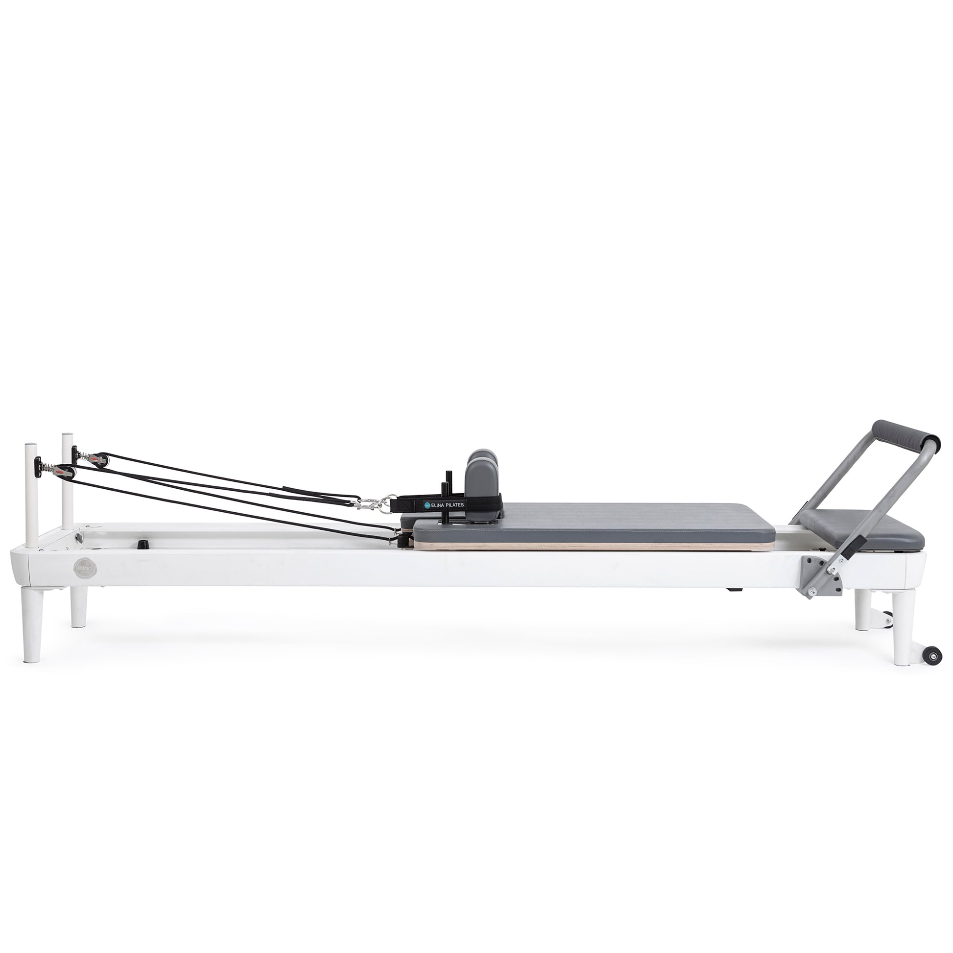 Side profile view of the Elina Pilates Nubium Reformer showcasing the sleek aluminum frame and grey upholstery