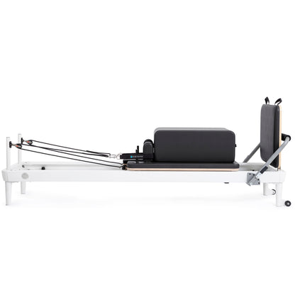 Extra-wide padded box attachment on the Elina Pilates Nubium Reformer for core and flexibility exercises
