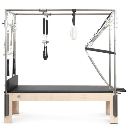 Side view of Elina Pilates Cadillac Trapeze Table with black leather upholstery and maple wood frame