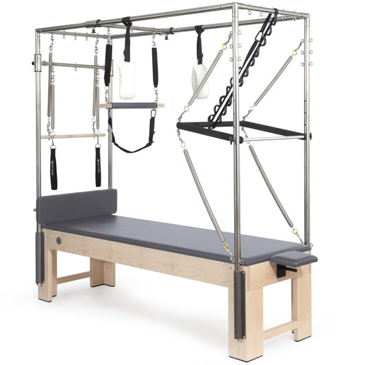 Front view of Elina Pilates Cadillac Trapeze Table with grey leather upholstery and maple wood frame
