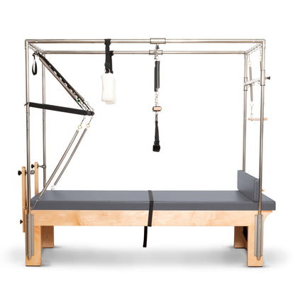 Full view of the Elina Pilates Cadillac Reformer showing complete frame, trapeze, and tower