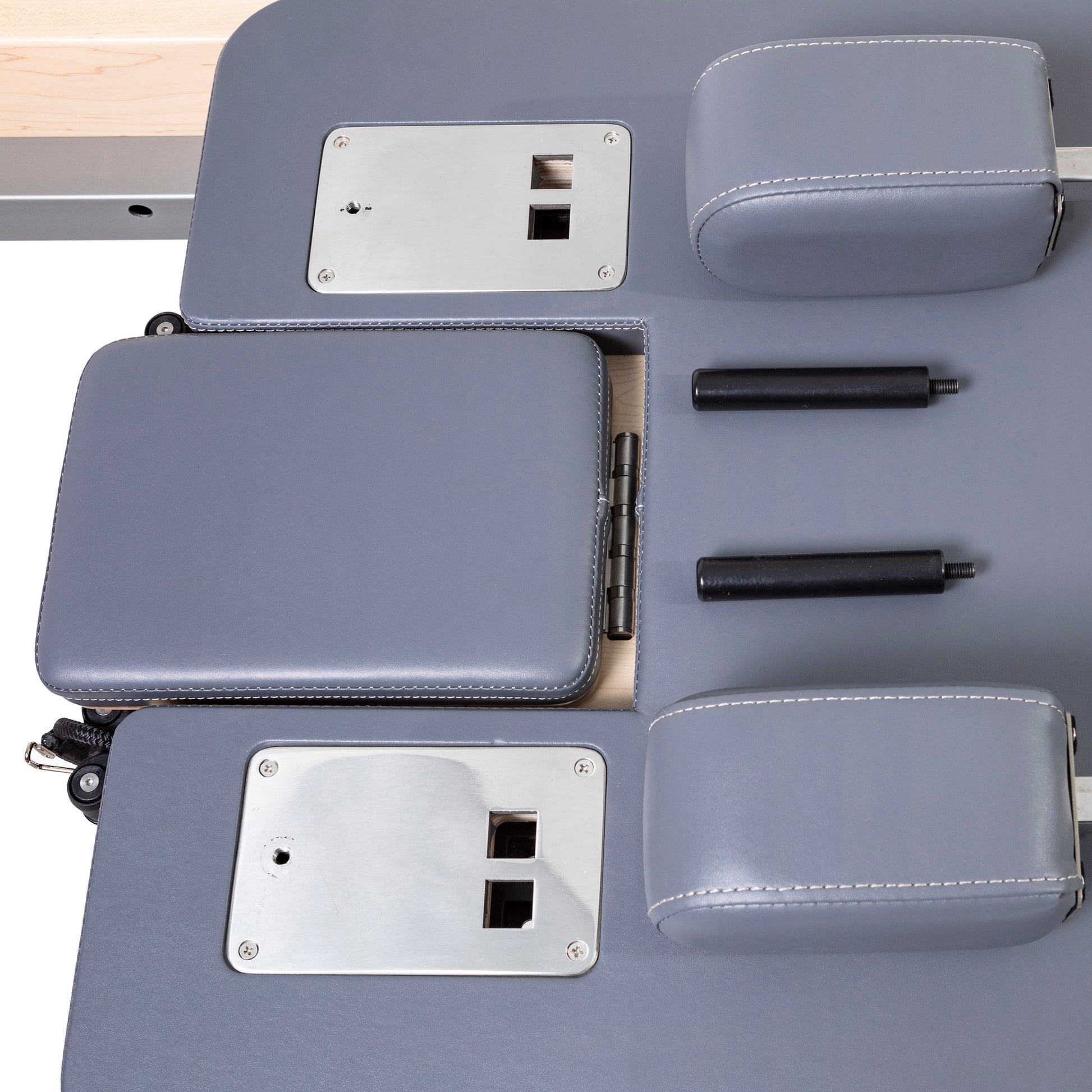 Padded shoulder rests with premium grey upholstery on the Master Instructor™ Pilates Reformer for enhanced comfort