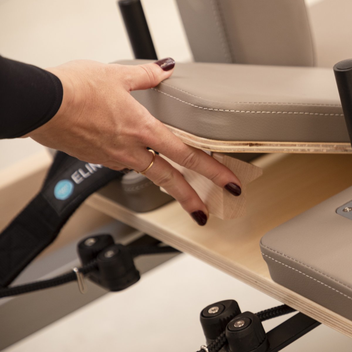 Padded shoulder rests with premium black upholstery on the Master Instructor™ Pilates Reformer for enhanced comfort