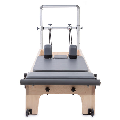 Front view of Elina Pilates Master Instructor™ Reformer with Mini-Tower and maple wood finish