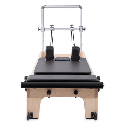 Front view of Elina Pilates Master Instructor™ Reformer with Mini-Tower and maple wood finish