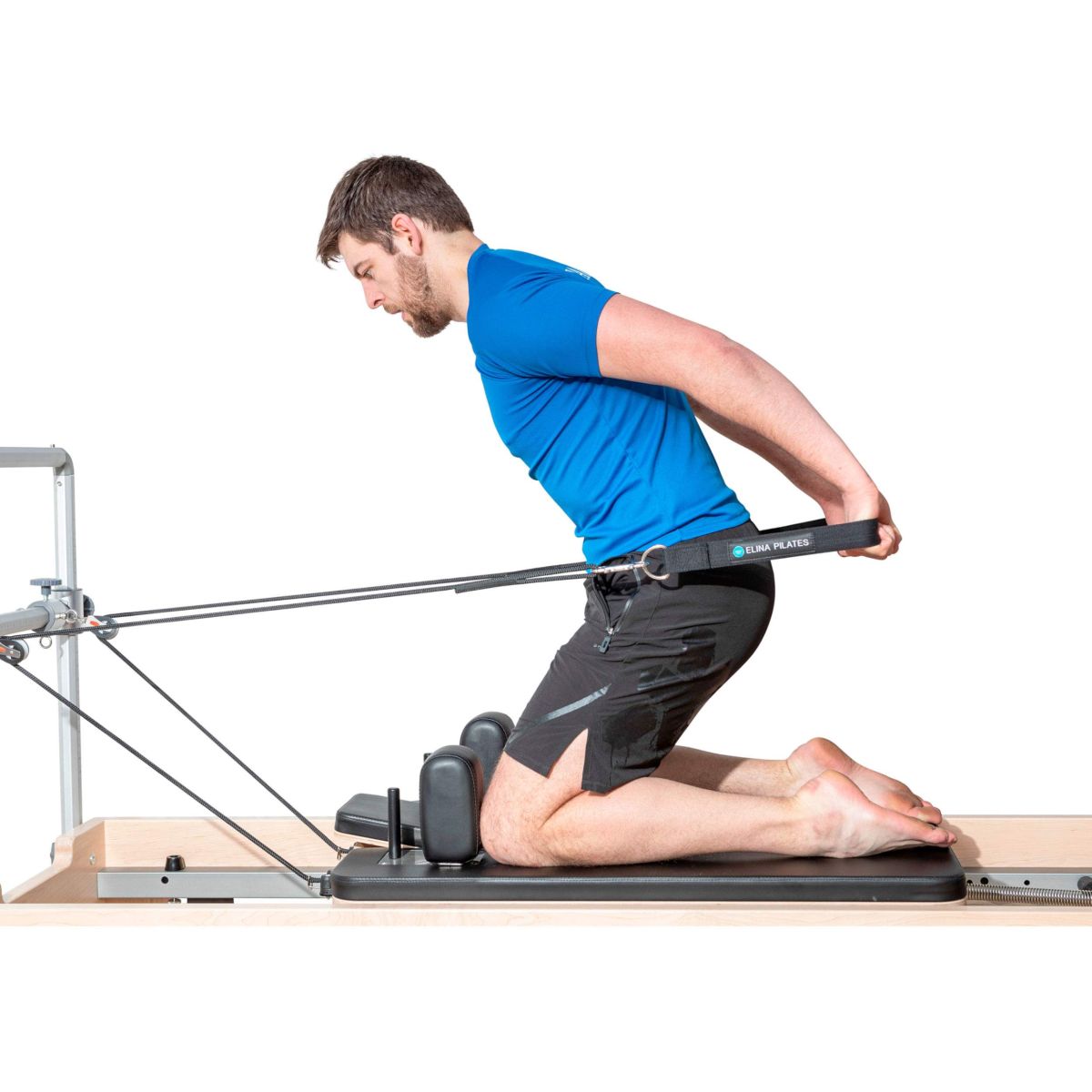 Pilates practitioner performing exercises on the Elina Pilates Physio Reformer Master Instructor with Mini-Tower in a studio setting
