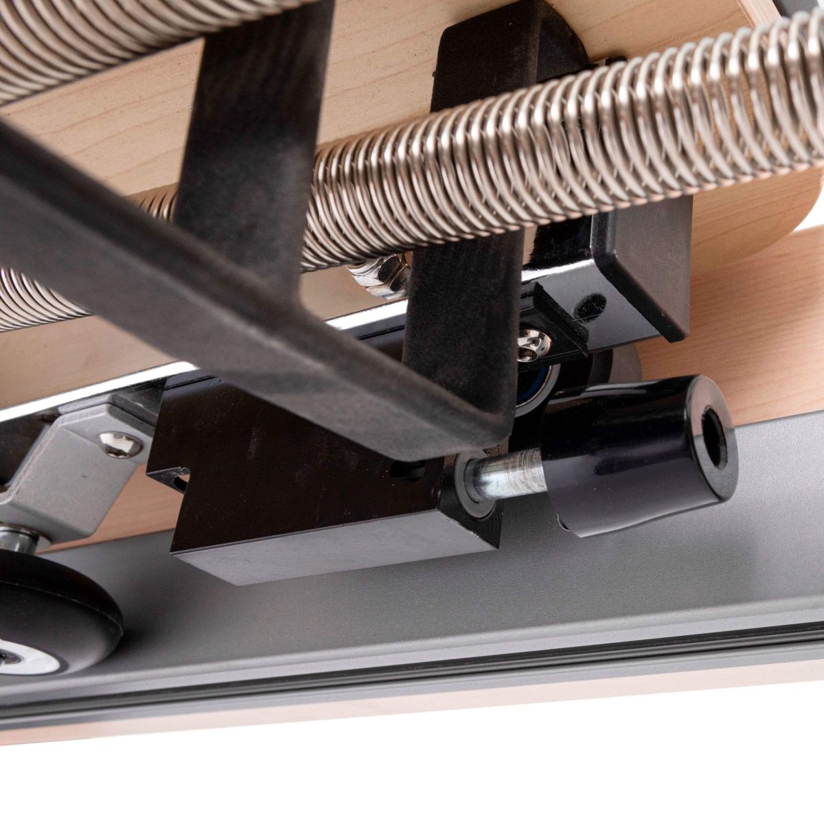 Close-up view of the Elina Pilates Physio Reformer’s adjustable resistance springs