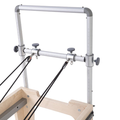 Close-up view of the Elina Pilates Physio Reformer’s mini-tower with adjustable pulleys and hexagonal grip handles in black upholstery