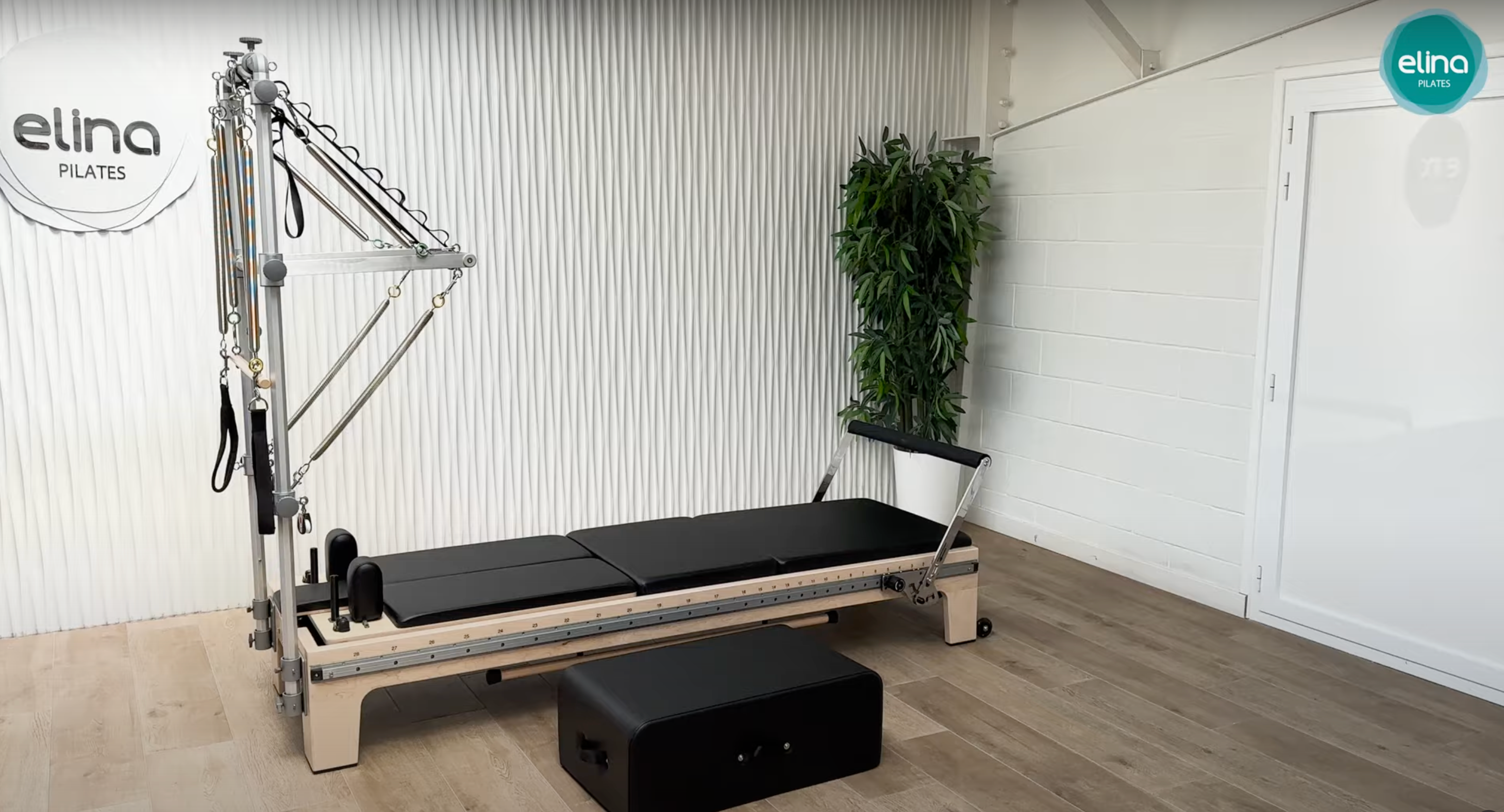 Elina Pilates Twin Reformer with Tower in Black — full front view showing double carriages and tower