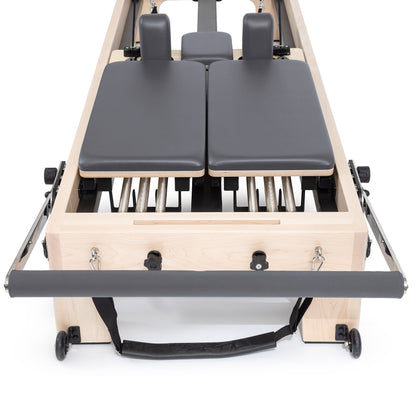 Quick-release footbar on Elina Reformer — shows multiple vertical and horizontal position settings