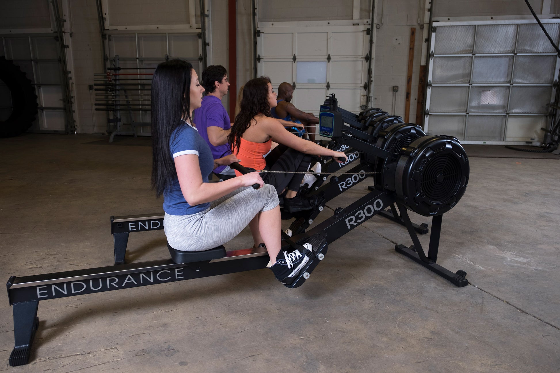 Users working out with the Endurance R300 Indoor Rower for full-body cardio workout