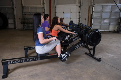 Users working out with the Endurance R300 Indoor Rower for full-body cardio workout