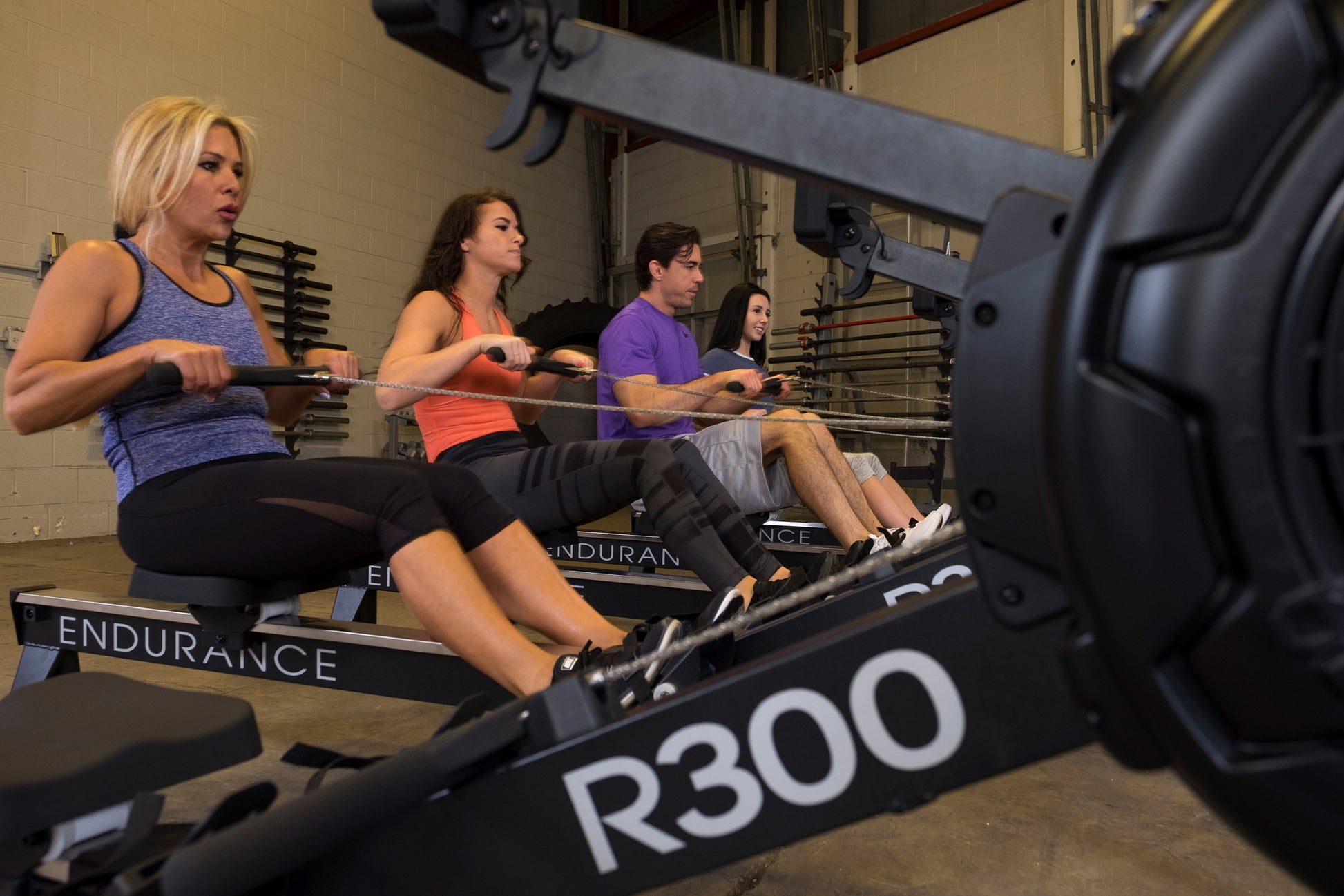Users working out with the Endurance R300 Indoor Rower for full-body cardio workout