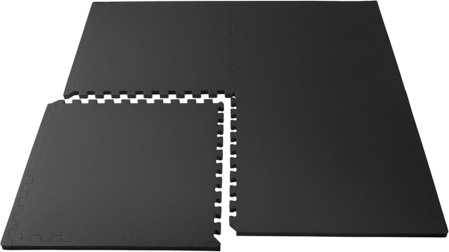 Measurement of 1-inch thick EVA foam floor tile with ruler for thickness reference