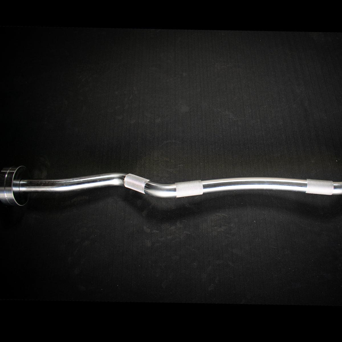 Close-up of ergonomic angled grip on curl bar